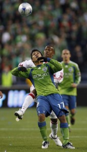 Seattle Sounders forward Fredy Montero, left, of Columbia, battles with New York Red Bulls