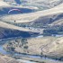 A solo paraglider sails south along the Yakima River Canyon as part of the annual autumn "Baldy (Butte) Fly-in" on Sept. 25, 2010, about 15 miles north of Selah, Wash.  The fly-in draws up to hundred paragliders from around the Northwest to enjoy exceptional flying conditions within the national scenic byway.